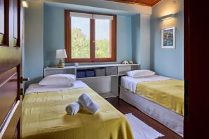 Posteľ alebo postele v izbe v ubytovaní Summerday Villa Private Beach
