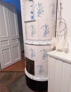 a stack of boxes with blue and white wallpaper at Old Apartment in Old Town in Stockholm