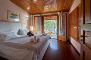 Posteľ alebo postele v izbe v ubytovaní Summerday Villa Private Beach