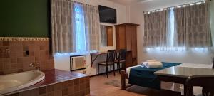 Cama ou camas em um quarto em Pousada 3 Corações Penedo