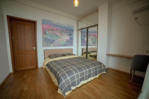 Postel nebo postele na pokoji v ubytování Luxury Villas in Alazani Valley Residence