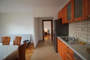 a kitchen with a sink and a counter top at Dolce Mare Apartmani in Pakoštane