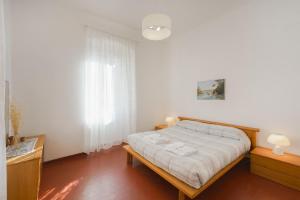 En eller flere senge i et værelse på La Casa di Gino - A due Passi dal Mare