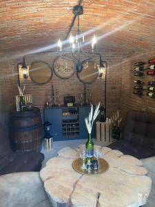 a room with a table with wine glasses on it at Cabaña Lambrusco - La Cava Lodge in Medellín +25 photos