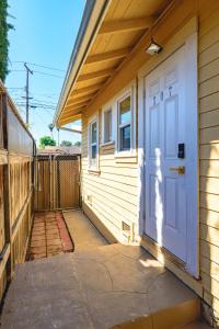 a house with a white door on the side of it at Comfortable Home Near LA with Full Kitchen & Laundry in Alhambra