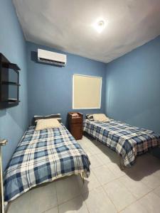 Postel nebo postele na pokoji v ubytování Casa en el centro de veracruz