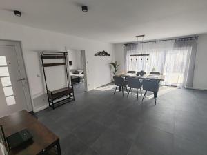 a living room with a dining room table and chairs at Ferienwohnung AnKe in Bad Neuenahr-Ahrweiler +5 photos