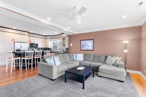 a living room with a couch and a table at Blue Marlin, Arcade, Hot Tub, Sleeps 10 in Lincoln City