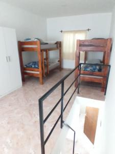 a room with two chairs and a table at Frutos de la Tierra in Comodoro Rivadavia
