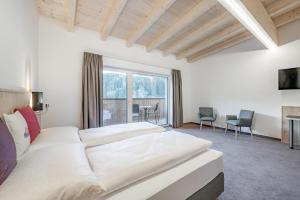 Postel nebo postele na pokoji v ubytování Seehüter's Hotel Seerose