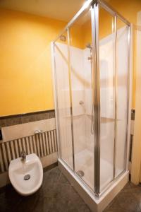 a bathroom with a shower and a toilet at Hotel Il Principe in Milazzo