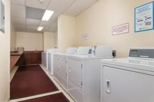 a row of washers and dryers in a room at Luxury 2-Bed Whistler Village in Whistler