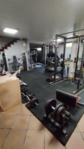 a gym with lots of equipment in a room at Casa San Roque in Villanueva de Arosa