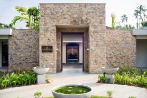 a entrance to a building with two bowls in front of it at Anantara Peace Haven Tangalle Resort in Tangalle