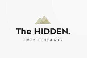 a logo for the hidden six hiddenaways at The HIDDEN Apartment in Flachau
