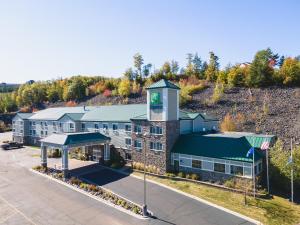 an aerial view of a building with a clock tower at Holiday Inn Express Houghton-Keweenaw by IHG in Houghton