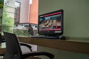 TV a/nebo společenská místnost v ubytování Inntu Hotel