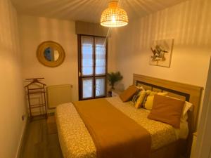 Ένα ή περισσότερα κρεβάτια σε δωμάτιο στο Apartamento Centro NOVORT