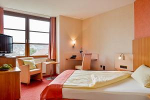 Postel nebo postele na pokoji v ubytování Hotel am Brenner + 16 fotografií