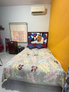 Postel nebo postele na pokoji v ubytování Casa en el centro de veracruz