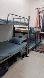 Postelja oz. postelje v sobi nastanitve Mohammad dormitory