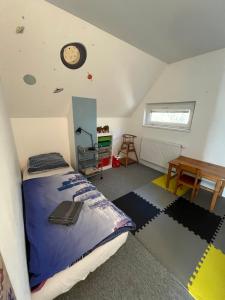 a bedroom with a bed and a clock on the ceiling at Randy's House Plzeň in Pilsen