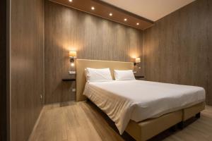 Postel nebo postele na pokoji v ubytování Hotel Tre Ville