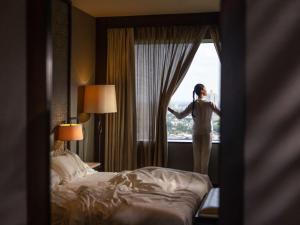 Ein Bett oder Betten in einem Zimmer der Unterkunft Fairmont Jakarta