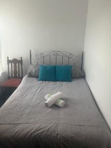 a stuffed animal is laying on a bed at Fir Trees in Blackpool