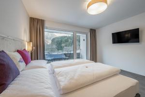 Postel nebo postele na pokoji v ubytování Seehüter's Hotel Seerose