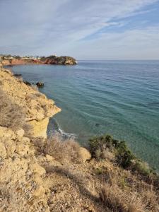 a view of the ocean from a cliff at Casa del Mar in Puerto de Mazarrón