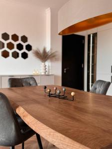 a dining room table with a game controller on it at SeaView Etara IV Apartment in Sveti Vlas in Sveti Vlas +80 photos