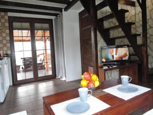 a living room with a table with fruit on it at Wooden House by Baltic Sea & Wolin Park in Międzyzdroje