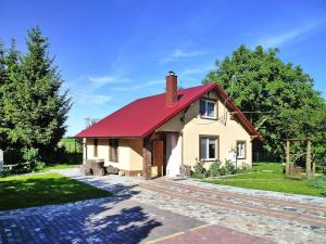 a small house with a red roof at House in Wiejkowo near Szczecin Lagoon in Wiejkowo