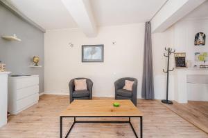 Posezení v ubytování Appartement de caractère hyper centre + 3 fotografie