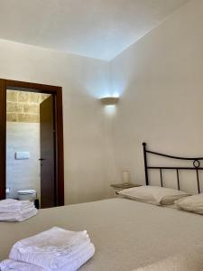 Postel nebo postele na pokoji v ubytování Le stanze di Ray - Salento Homes