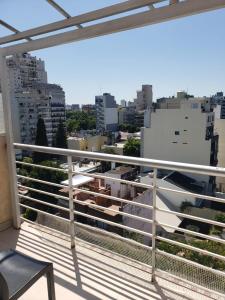 a balcony with a view of a city at Comfortable Apartamento Semi Piso in Buenos Aires
