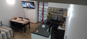 a living room with a table and a fireplace at Da zia Iole a piazza Armerina città dei mosaici patrimonio dell'unesco in Piazza Armerina