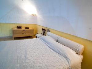 En eller flere senge i et værelse på Casa Vacanze Massa Lubrense