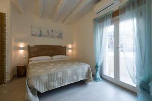 Postel nebo postele na pokoji v ubytování Le Nereidi B&B