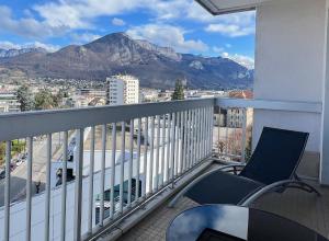 a balcony with chairs and a view of a mountain at Mont Royal - piscine - balcon vue imprenable sur les montagnes in Annecy