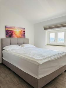 Postel nebo postele na pokoji v ubytování Apartment Aurora