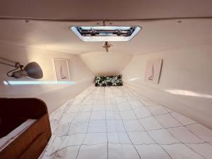 an overhead view of a small room with a ceiling at Bacus - Your Floating Hideaway in Lisbon in Lisbon
