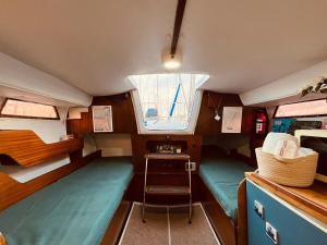 a small room with a table and a window at Bacus - Your Floating Hideaway in Lisbon in Lisbon