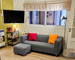 TV a/nebo společenská místnost v ubytování Itaca Hostel