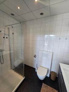 Koupelna v ubytování Hart van Warder