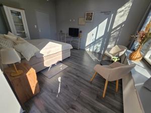 Posezení v ubytování Hart van Warder + 7 fotografií