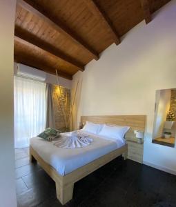 Postel nebo postele na pokoji v ubytování La Volta Rooms Locazione turistica