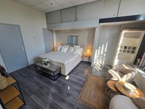 Postel nebo postele na pokoji v ubytování Hart van Warder