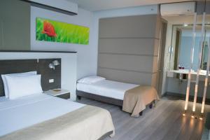 Postel nebo postele na pokoji v ubytování Inntu Hotel